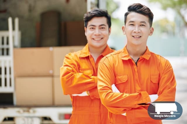 Naqla Movers crew members working together on a moving job