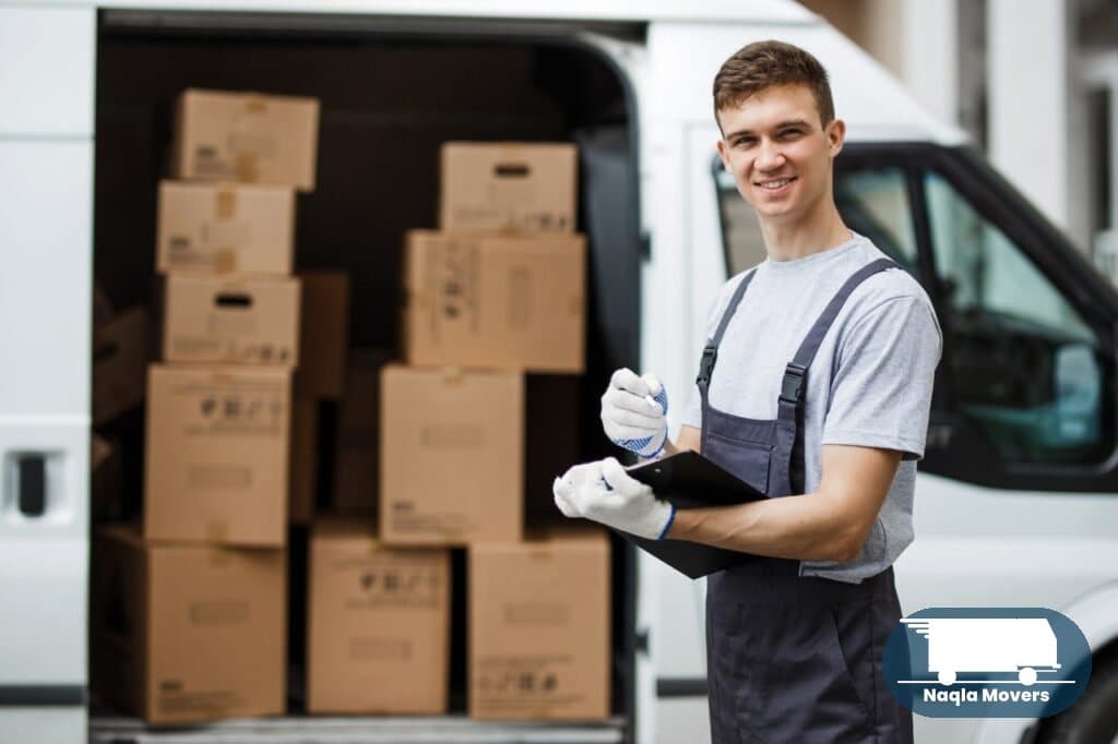 Naqla Movers crew member with moving van