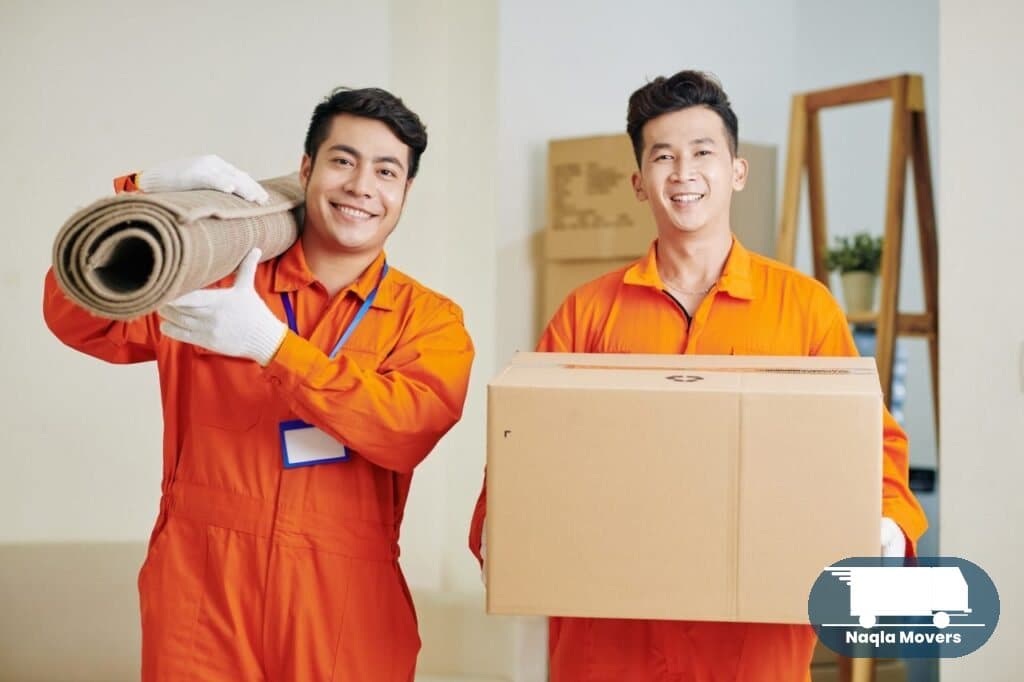 Naqla Movers crew carrying furniture